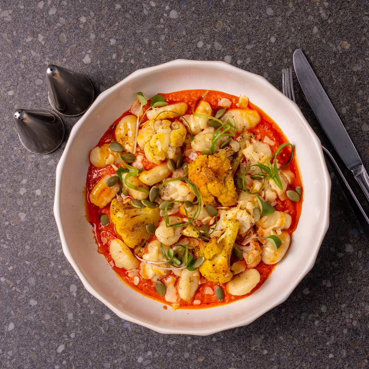 Family Gnocchi and Charred Cauliflower in a Roasted Red Pepper Pesto